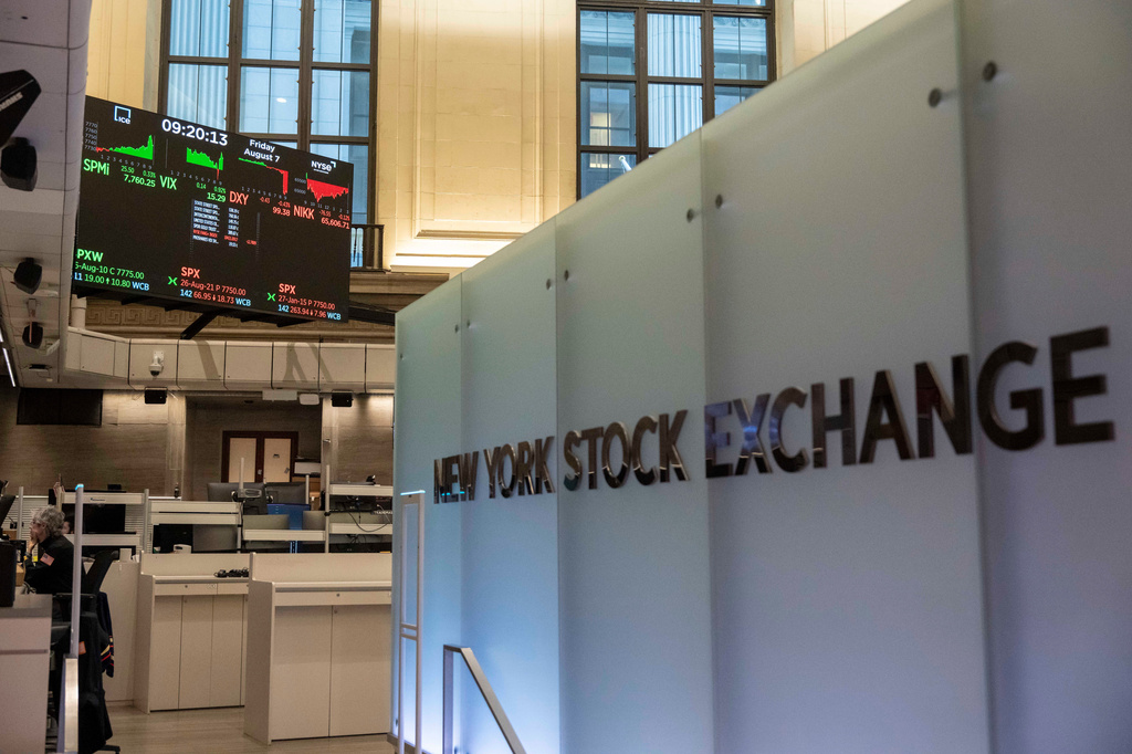 Financial information is displayed on the screen on the floor of the New York Stock Exchange, Friday, Aug. 7, 2026, in New York. (AP Photo/Yuki Iwamura)