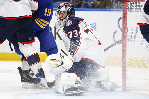 Columbus Blue Jackets goaltender Jet Greaves (73) looks for the puck in traffic during the first period of an NHL hockey game against the Buffalo Sabres Tuesday, Oct. 28, 2025, in Buffalo, N.Y. (AP Photo/Jeffrey T. Barnes) Columbus Blue Jackets goaltender Jet Greaves (73) looks for the puck in traffic during the first period of an NHL hockey game against the Buffalo Sabres Tuesday, Oct. 28, 2025, in Buffalo, N.Y. (AP Photo/Jeffrey T. Barnes)