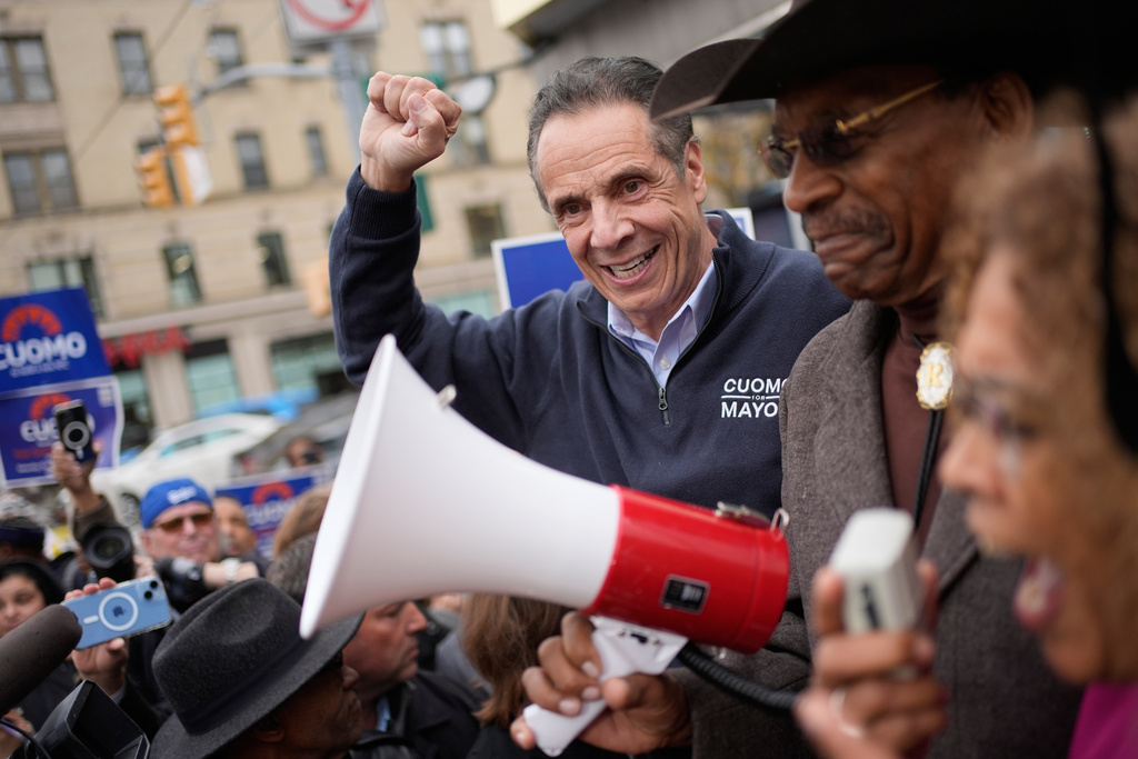 New York City mayoral candidate Andrew Cuomo cheers along with supporters while campaigning in New York, Monday, Nov. 3, 2025. (AP Photo/Seth Wenig)