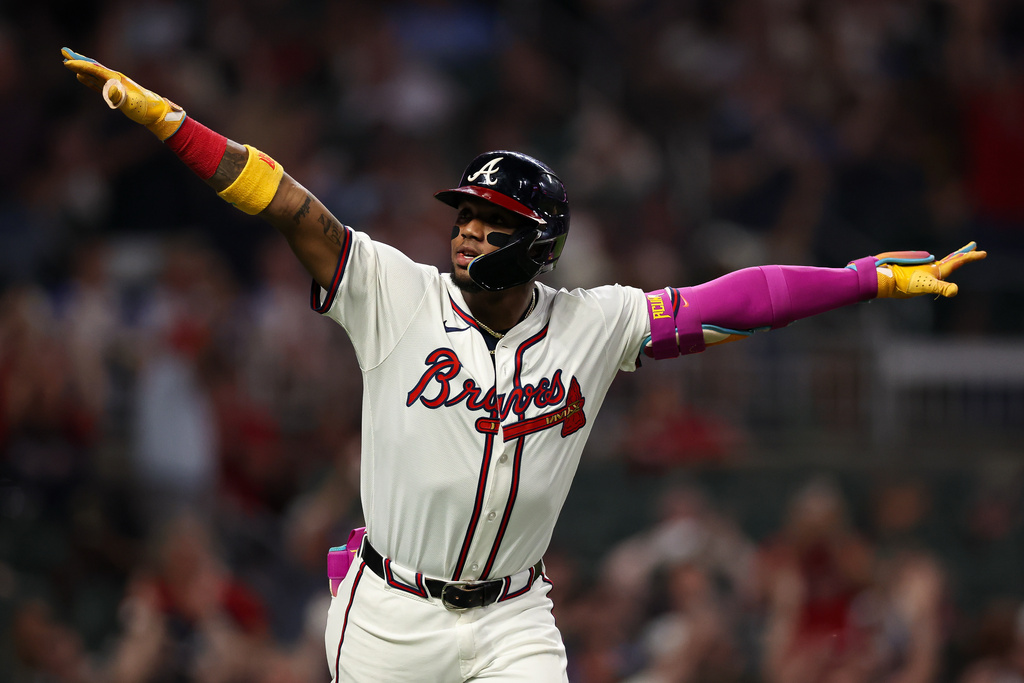Atlanta Braves' Ronald Acuña Jr. reacts after hitting a solo home run in the sixth inning of a baseball game against the Washington Nationals, Tuesday, Sept. 23, 2025, in Atlanta. (AP Photo/Colin Hubbard)