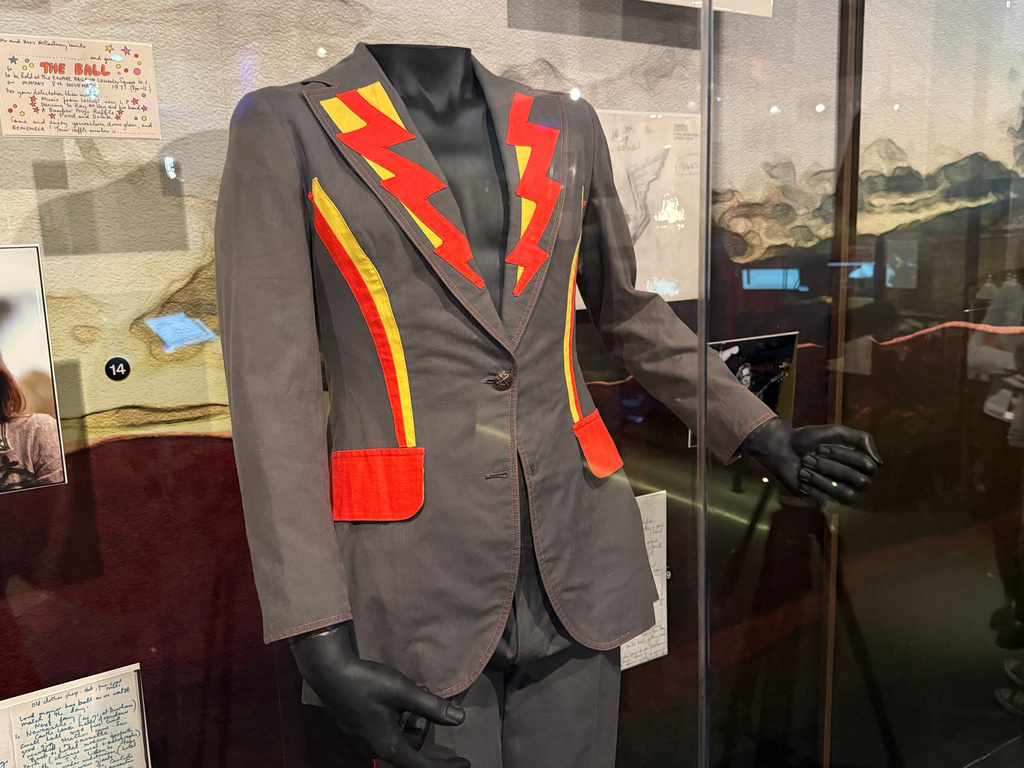A costume sits on a mannequin inside the Paul McCartney and WINGS exhibit at the Rock Roll Hall of Fame on Thursday, May 14, 2026, in Cleveland, Ohio. (AP Photo/Patrick Aftoora-Orsagos)