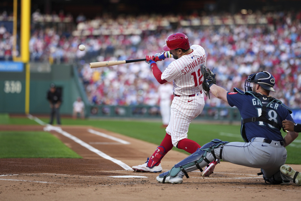 Philadelphia Phillies' Kyle Schwarber hits a home run against Seattle Mariners pitcher Bryce Miller during the first inning of a baseball game Tuesday, Aug. 19, 2025, in Philadelphia. (AP Photo/Matt Slocum)