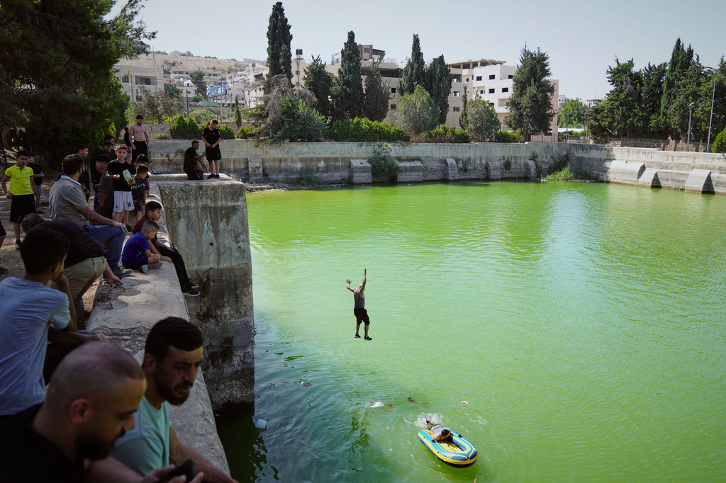 Palestinians cool off at the site of Solomon's Pools an ancient water reservoirs located south of the West Bank city of Bethlehem, on July 31, 2026. (AP Photo/Mahmoud Illean)