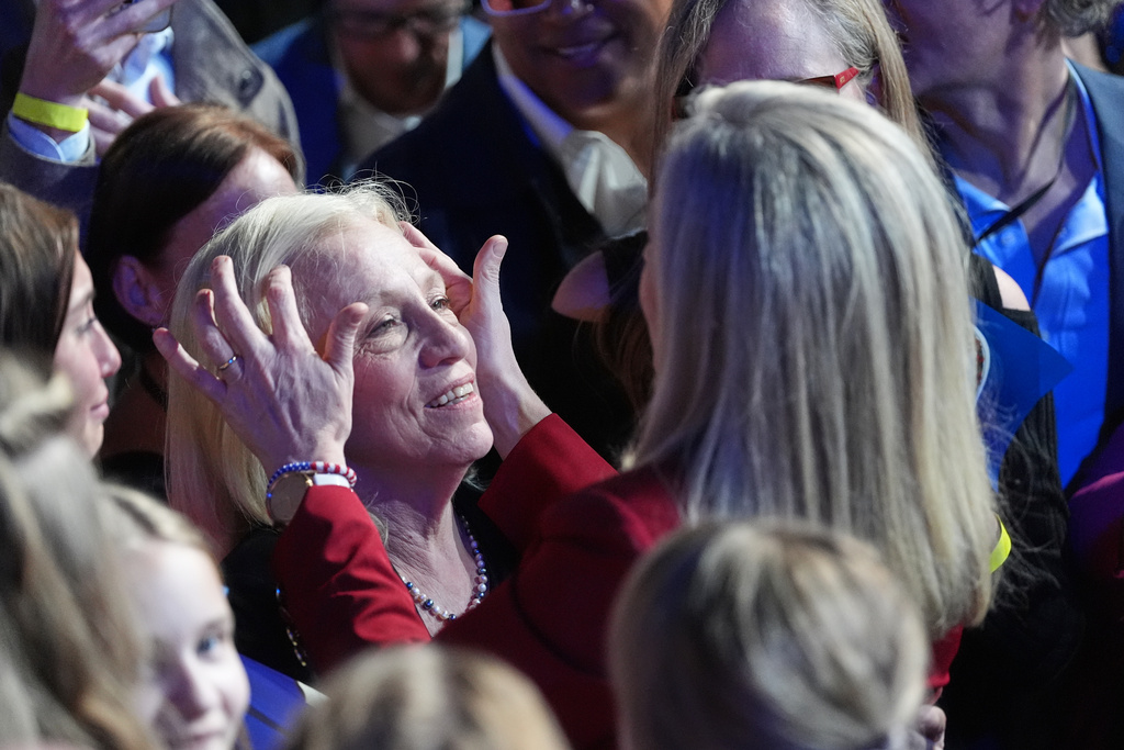 Democrat Abigail Spanberger, right, shares a moment with her mother after she was declared the winner of the Virginia governor's race during an election night watch party Tuesday, Nov. 4, 2025, in Richmond, Va. (AP Photo/Stephanie Scarbrough)