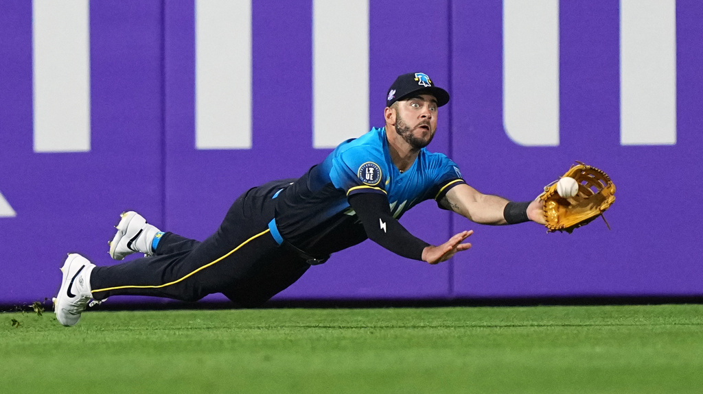 Philadelphia Phillies left fielder Otto Kemp catches a line out by Atlanta Braves' Ronald Acuña Jr. during the sixth inning of a baseball game, Friday, April 17, 2026, in Philadelphia. (AP Photo/Matt Rourke)