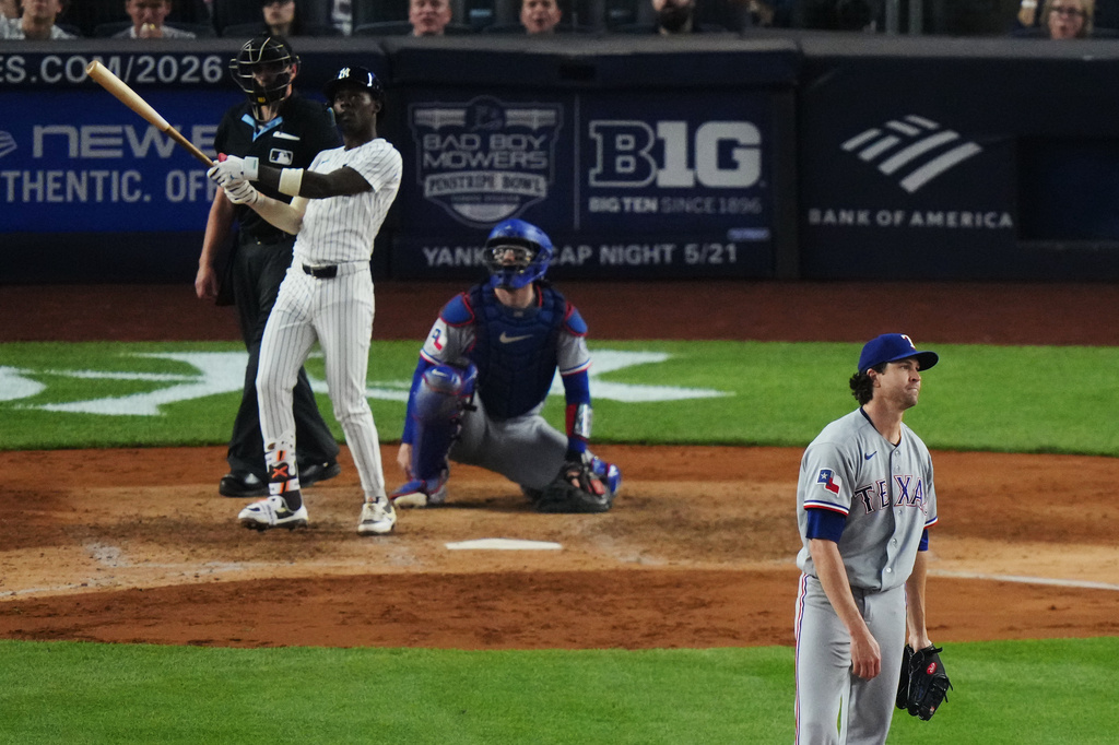 Texas Rangers pitcher Jacob Degrom, right, reacts as New York Yankees' Jazz Chisholm Jr. follows through on a home run during the sixth inning of a baseball game Tuesday, May 5, 2026, in New York. (AP Photo/Frank Franklin II)