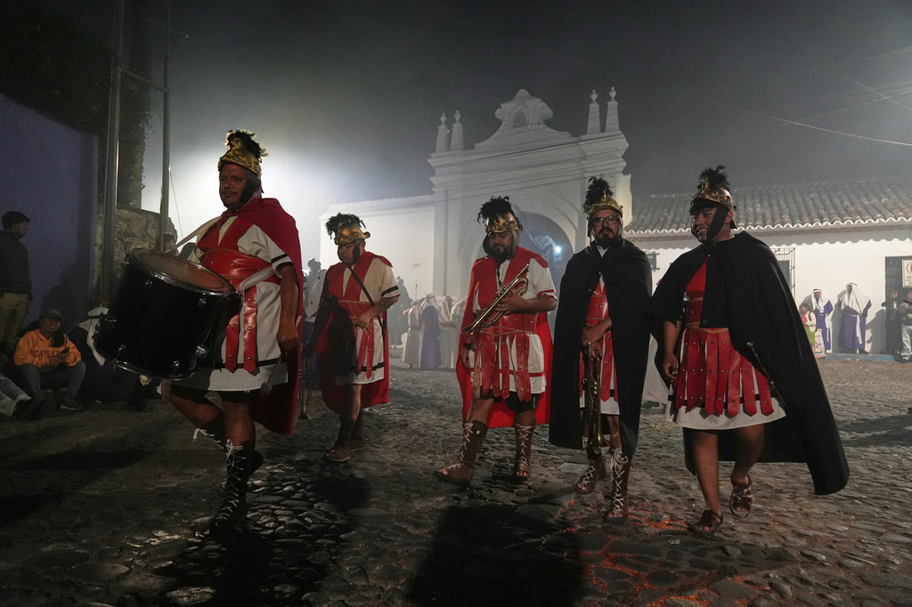 Musicians dressed as Roman soldiers take part in La Merced church's Good Friday procession during Holy Week in Antigua, Guatemala, Friday, April 3, 2026. (AP Photo/Moises Castillo)