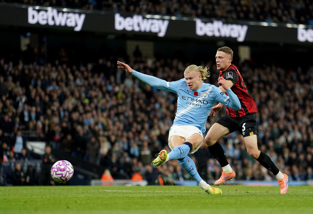 Manchester City's Erling Haaland scores his sides first goal during the English Premier League soccer match between Manchester City and Bournemouth in Manchester, England, Sunday, Nov. 2, 2025. (Martin Rickett/PA via AP)