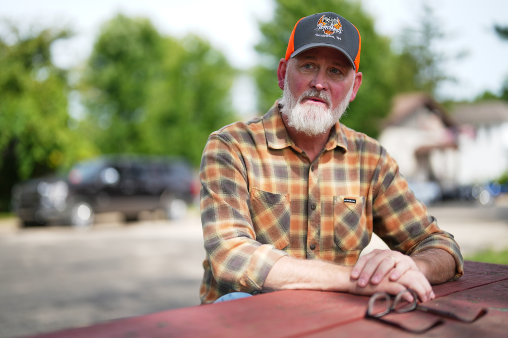 U.S. Rep. Derrick Van Orden speaks during an interview after a Labor Day parade, Monday, Sept. 7, 2026, in Readstown, Wis. (AP Photo/Ellen Schmidt)