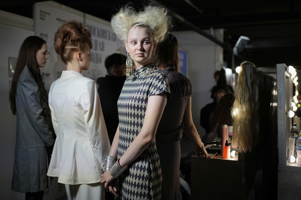 Models are prepared for a runway show at the backstage of the Moscow Fashion Week in Moscow, Russia, Friday, Aug. 29, 2025. (AP Photo/Pavel Bednyakov)