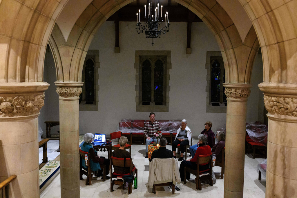 Participants meditate in silence during an interfaith meditation practice at All Saints Episcopal Church in Pasadena, Calif., on Monday, Dec. 15, 2025. (AP Photo/William Liang)