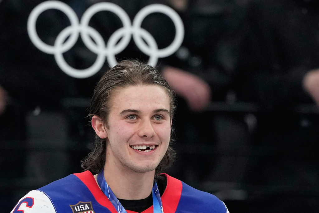 United States' Jack Hughes (86) reacts after receiving his gold medal after the USA defeated Canada in the men's ice hockey gold medal game at the 2026 Winter Olympics, in Milan, Italy, Sunday, Feb. 22, 2026. (AP Photo/Hassan Ammar)