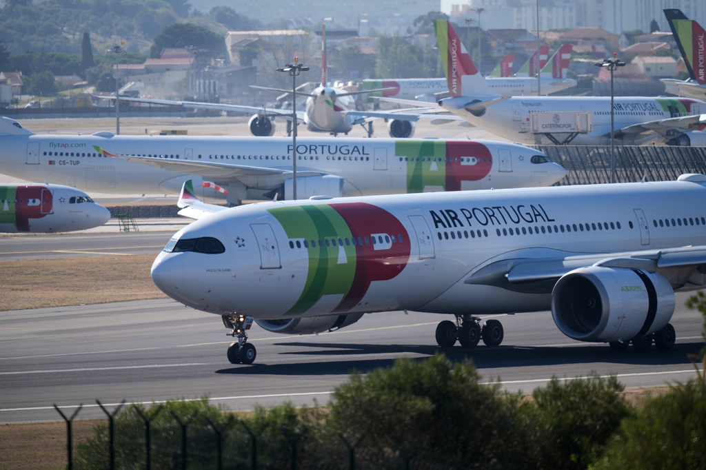 A TAP Air Portugal Airbus A330 lands in Lisbon, Wednesday, Oct. 14, 2026, the day that the Portuguese government announced Lufthansa Group the winner of the bid for a minority stake in the Portuguese airline. (AP Photo/Armando Franca)