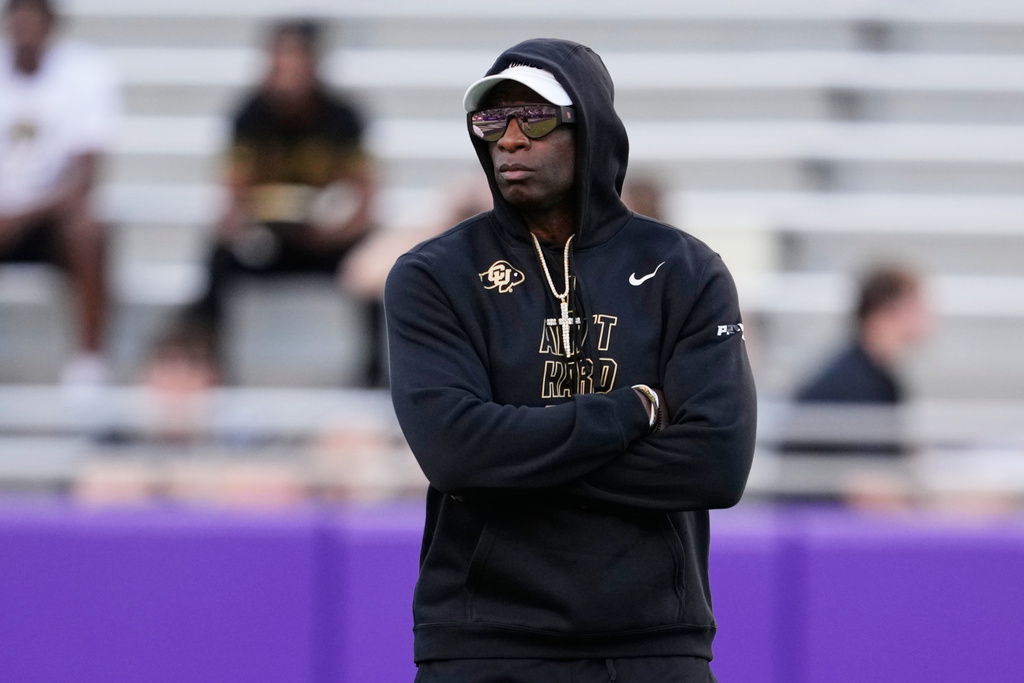 Colorado head coach Deion Sanders watches his team warm up before an NCAA college football game against TCU Saturday, Oct. 4, 2025, in Fort Worth, Texas. (AP Photo/Tony Gutierrez)