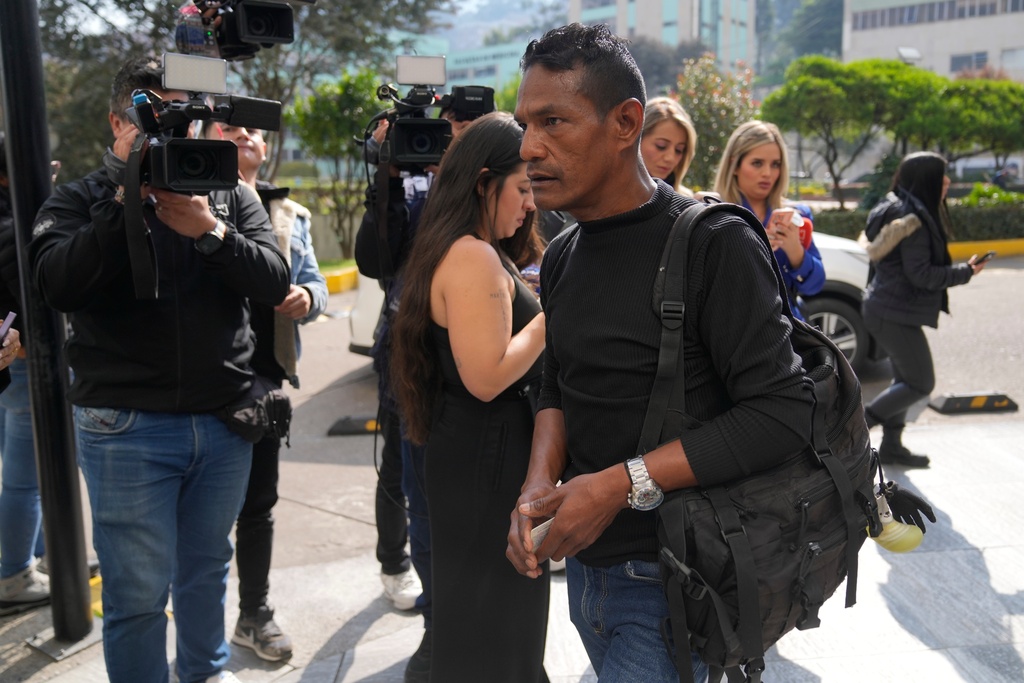 Manuel Lopez, a relative of soldier Antonio Lopez who was on a cargo plane that crashed shortly after take off the previous day in Puerto Leguizamo, arrives at the military hospital where he is being treated in Bogota, Colombia, Tuesday, March 24, 2026. (AP Photo/Fernando Vergara)