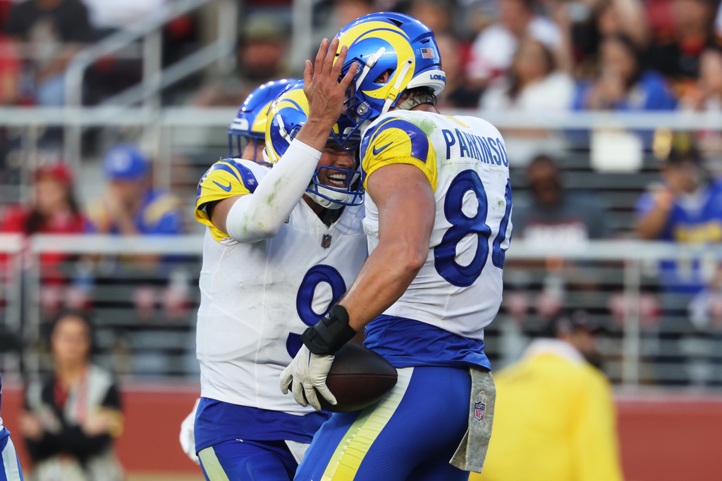 Los Angeles Rams quarterback Matthew Stafford (9) celebrates after throwing a touchdown pass to tight end Colby Parkinson (84) during the second half of an NFL football game against the San Francisco 49ers in Santa Clara, Calif., Sunday, Nov. 9, 2025. (AP Photo/Jed Jacobsohn)
