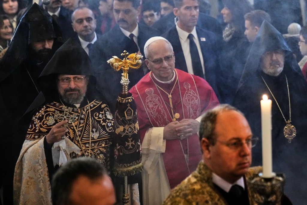 Pope Leo XIV and the Armenian Patriarch of Constantinople Archbishop Sahag II Mashalian arrive to celebrate a liturgy in the Armenian Apostolic Cathedral of Istanbul, Turkey, Sunday, Nov. 30, 2025. (AP Photo/Domenico Stinellis)