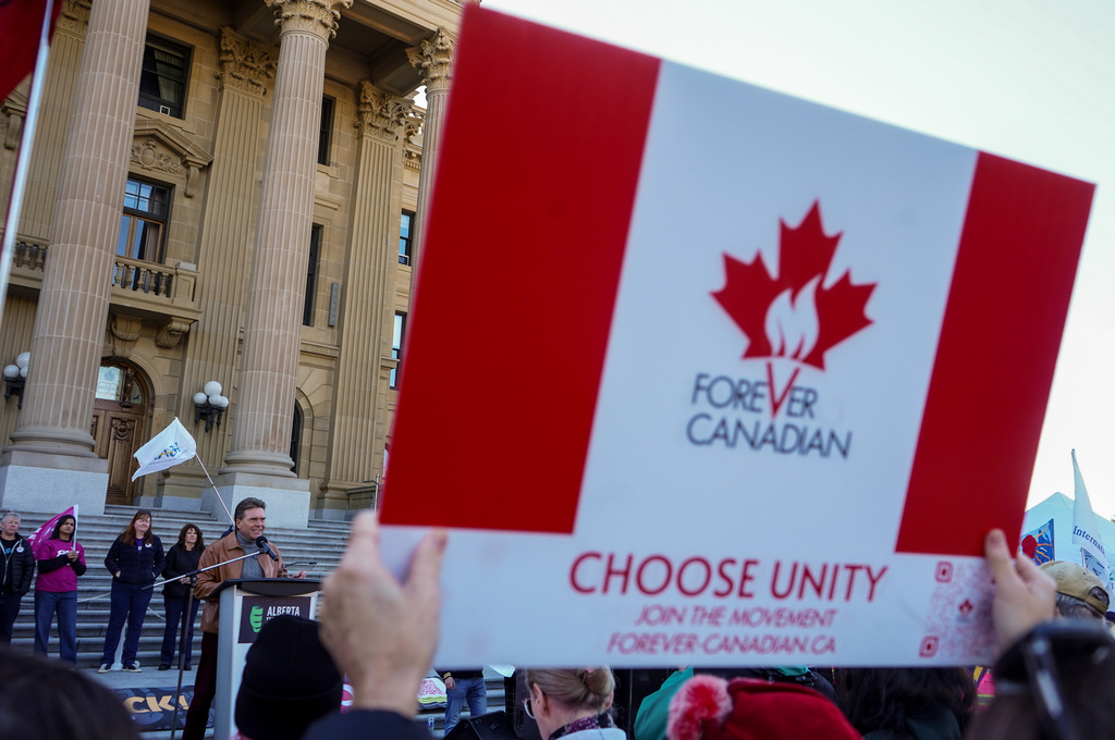 Forever Canada leader Thomas Lukaszuk, left, gives a speech during a pro-Canada rally in Edmonton, Alberta, Sunday, Oct, 18, 2026. (Timon Johnson/The Canadian Press via AP)