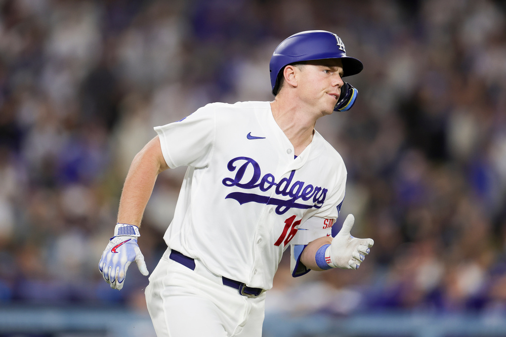 Los Angeles Dodgers' Will Smith runs the bases after hitting a three-run home run during the third inning of a baseball game against the Chicago Cubs Friday, April 24, 2026, in Los Angeles. (AP Photo/Ryan Sun)