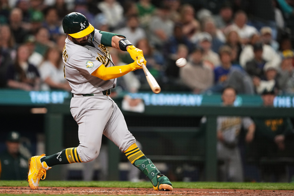 Athletics' Shea Langeliers hits a solo home run against the Seattle Mariners during the sixth inning of a baseball game, Monday, April 20, 2026, in Seattle. (AP Photo/Lindsey Wasson)