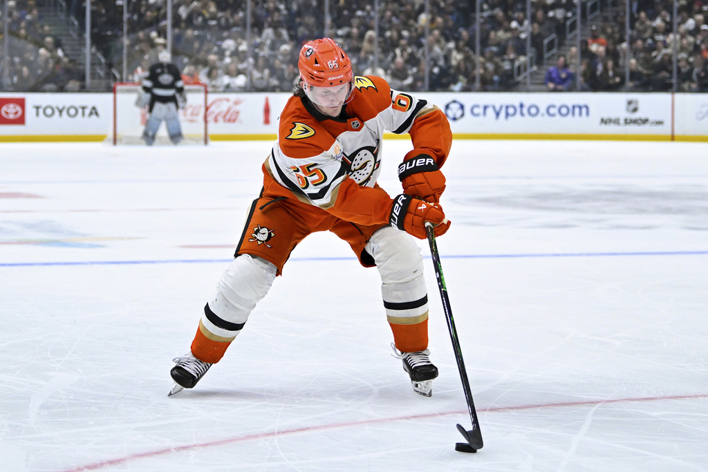 Anaheim Ducks defenseman Jacob Trouba (65) skates with the puck during the second period of an NHL hockey game against the Los Angeles Kings, Saturday, Dec. 27, 2025, in Los Angeles. (AP Photo/Katie Chin)