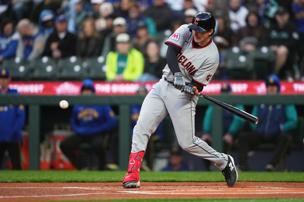 Cleveland Guardians' Chase DeLauter hits a solo home run against the Seattle Mariners during the first inning of a baseball game, Friday, March 27, 2026, in Seattle. (AP Photo/Lindsey Wasson)