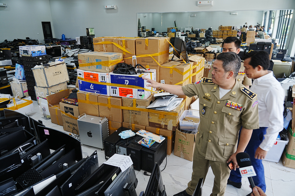 FILE - Bun Sosekha, Deputy Commissioner in charge of Security Unit, Phnom Penh Municipal Police, gives a tour of a scam center to journalists in Phnom Penh, Cambodia, Wednesday, March 11, 2026. (AP Photo/Heng Sinith, file)