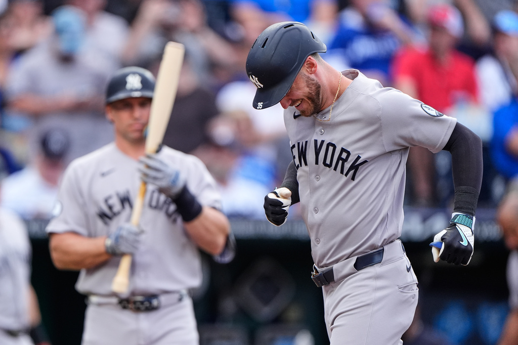 New York Yankees' Cody Bellinger runs home after hitting a solo home run during the first inning of baseball game against the Kansas City Royals, Tuesday, May 26, 2026, in Kansas City, Mo. (AP Photo/Charlie Riedel)