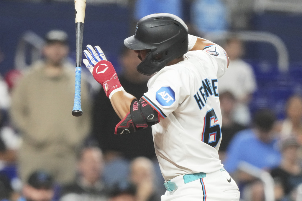 Heriberto Hernandez reacts after being hit by a pitch thrown by St. Louis Cardinals starting pitcher Michael McGreevy during the sixth inning of a baseball game, Tuesday, Aug. 19, 2025, in Miami. (AP Photo/Lynne Sladky)
