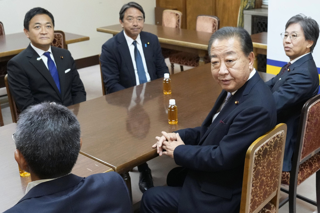 Yoshihiko Noda, front right, leader of the Constitutional Democratic Party of Japan, meets with Democratic Party For the People Representative Yuichiro Tamaki, rear left, at the parliament in Tokyo on Sept. 18, 2025. The senior leaders are Jun Azumi, far right, of the Constitutional Democratic Party of Japan and Kazuya Shimba, second left at rear of Democratic Party For the People Representative. (Daisuke Suzuki/Kyodo News via AP)