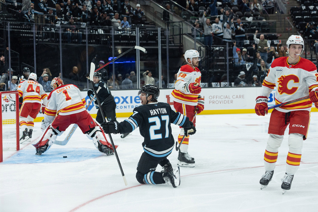 Utah Mammoth center Barrett Hayton (27) celebrates the goal against the Calgary Flames during the second half of an NHL hockey game Wednesday, Oct. 15, 2025, in Salt Lake City. (AP Photo/Melissa Majchrzak)
