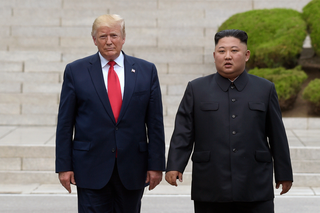 FILE - President Donald Trump, left, meets with North Korean leader Kim Jong Un at the North Korean side of the border at the village of Panmunjom in Demilitarized Zone, June 30, 2019. (AP Photo/Susan Walsh, File)