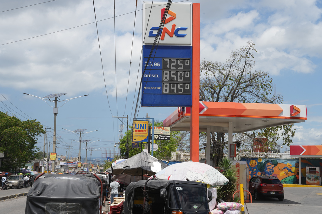A gas station advertises prices in Port-au-Prince, Haiti, Tuesday, April 7, 2026. (AP Photo/Odelyn Joseph)