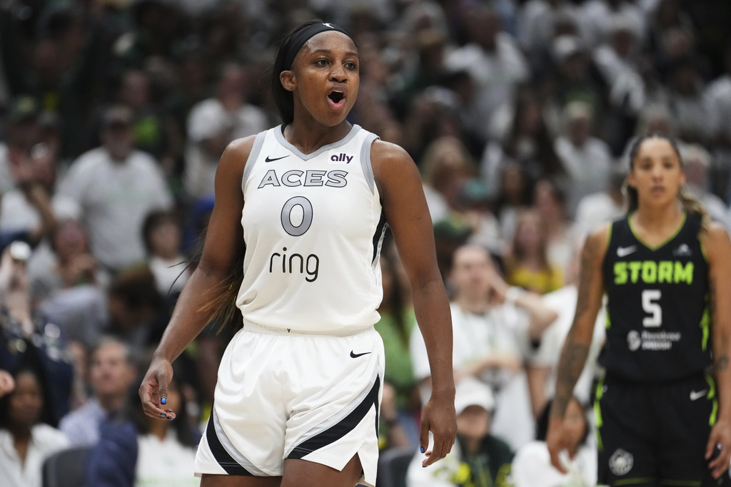 Las Vegas Aces guard Jackie Young reacts during the second half of Game 2 in the first round of the WNBA basketball playoffs against the Seattle Storm, Tuesday, Sept. 16, 2025, in Seattle. (AP Photo/Lindsey Wasson)