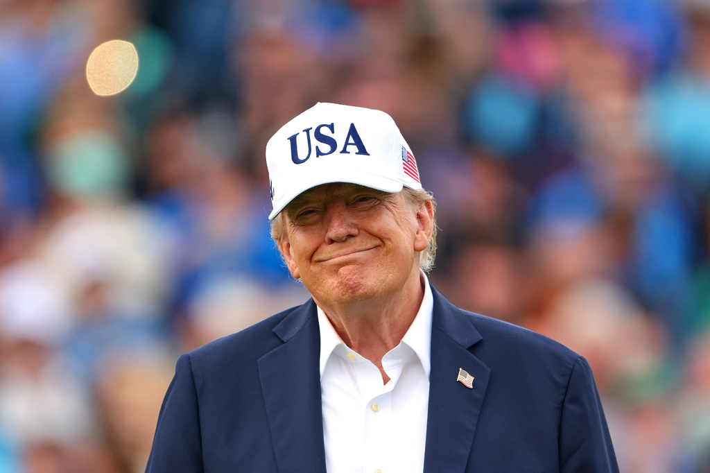 U.S. President Donald Trump smiles after the trophy presentation of the Irish Open at the Trump International Golf Links course in Doonbeg, Ireland, Sunday, Sept. 13, 2026.(AP Photo/Peter Morrison)