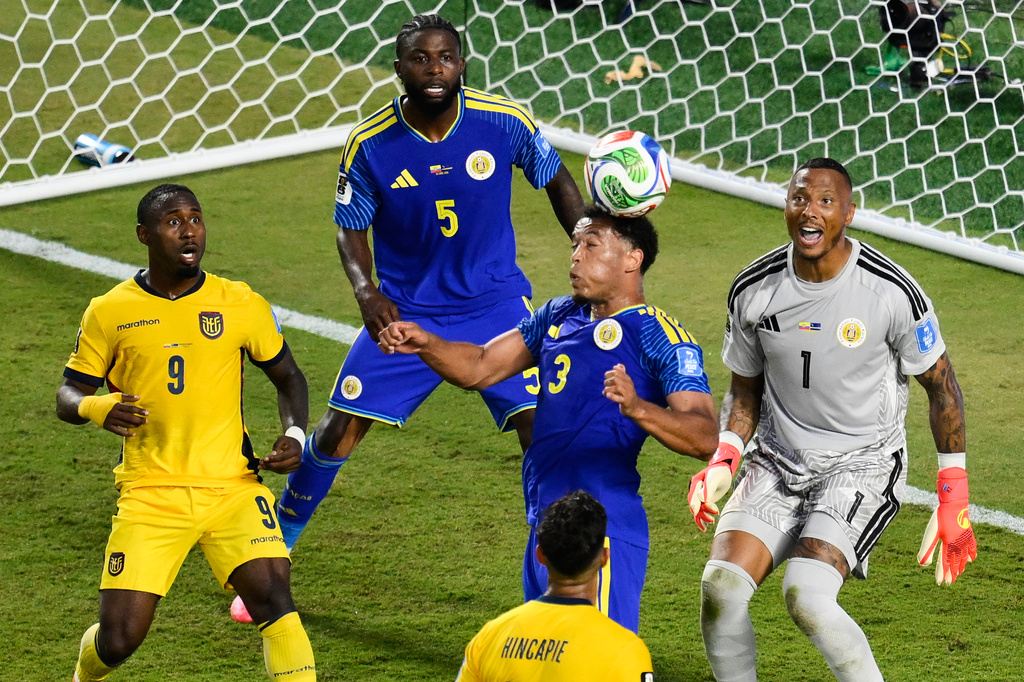 Curaçao's Jurien Gaari (3) heads the ball away on a corner kick as Ecuador's John Yeboah (9) and Curaçao goalkeeper Eloy Room (1) and Sherel Floranus (5) look on during the World Cup Group E soccer match between Ecuador and Curacao in Kansas City, Mo., Saturday, June 20, 2026. (AP Photo/Reed Hoffmann)