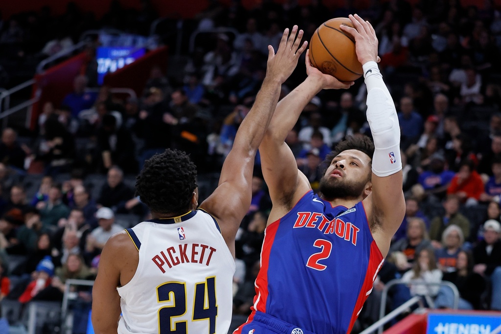 Detroit Pistons guard Cade Cunningham (2) takes a shot against Denver Nuggets guard Jalen Pickett (24) during the first half of an NBA basketball game, Tuesday, Feb. 3, 2026, in Detroit. (AP Photo/Duane Burleson)