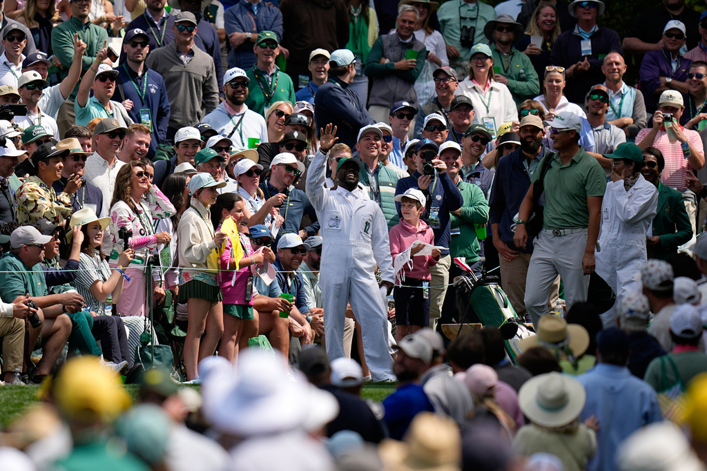 Actor Kevin Hart waves on the sixth hole during par-3 contest ahead of the Masters golf tournament at the Augusta National Golf Club, Wednesday, April 8, 2026, in Augusta, Ga. (AP Photo/Eric Gay)