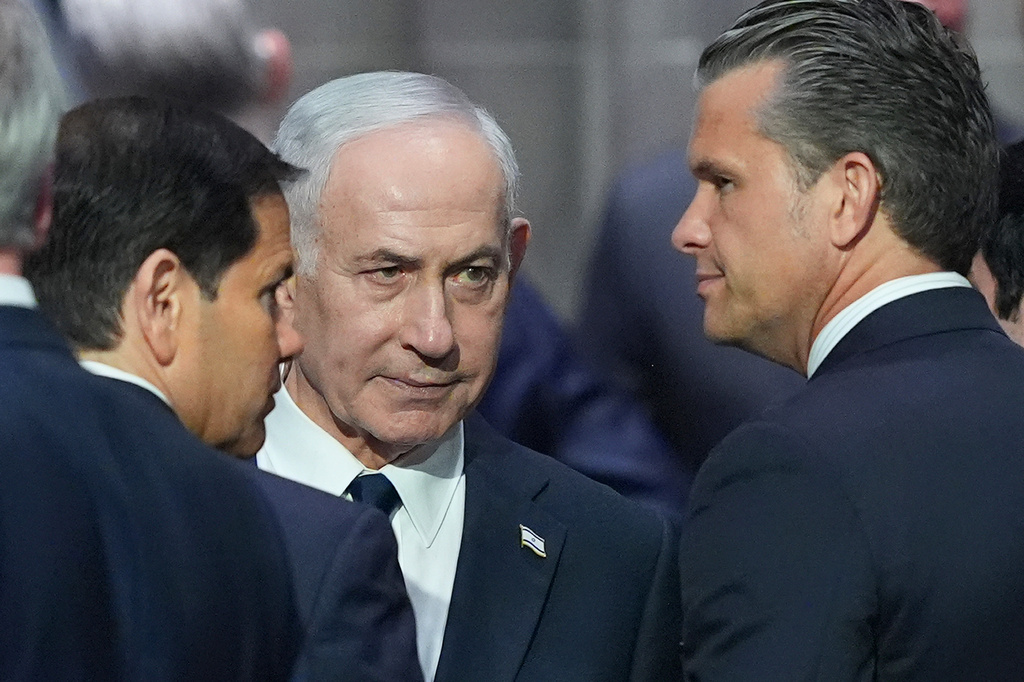 Israeli Prime Minister Benjamin Netanyahu, center, speaks to Secretary of Defense Pete Hegseth, right, and Secretary of State Marco Rubio, left, before the funeral of Sen. Lindsey Graham, R-S.C., Tuesday July 28, 2026, at the Washington National Cathedral in Washington. (AP Photo/Jacquelyn Martin)
