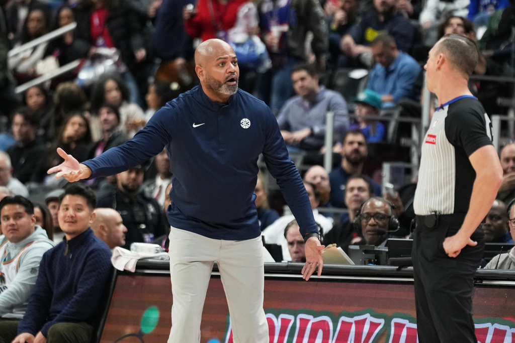 Detroit Pistons head coach J.B. Bickerstaff, left, reacts against referee Justin Van Duyne during the first half of an NBA basketball game against the Portland Trail Blazers, Friday, Dec. 5, 2025, in Detroit. (AP Photo/Ryan Sun)