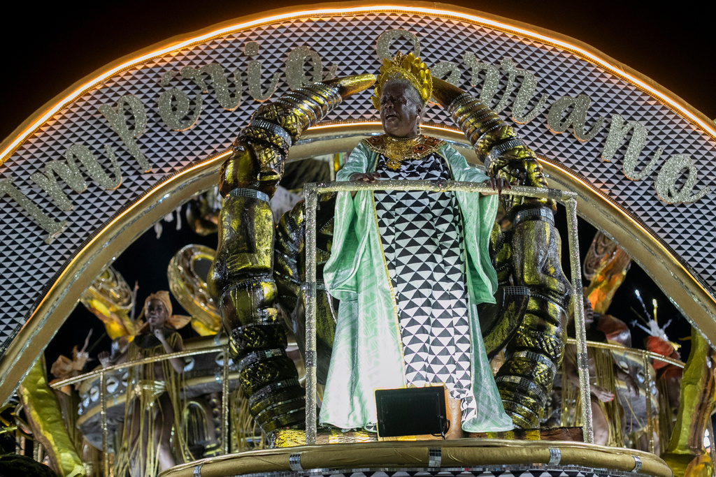 Brazilian writer Conceicao Evaristo is honored by the Imperio Serrano samba school during Carnival celebrations at the Sambadrome in Rio de Janeiro, early Sunday, Feb. 15, 2026. (AP Photo/Bruna Prado)