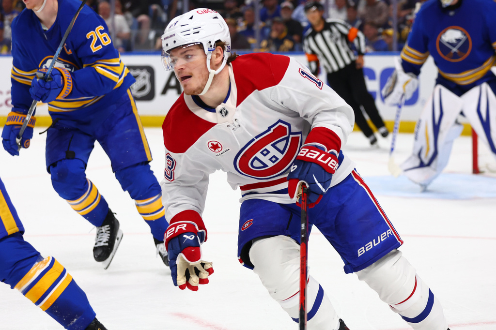 Montreal Canadiens right wing Cole Caufield, right, skates out of the zone during the second period in Game 7 of a second-round NHL hockey Stanley Cup playoff series against the Buffalo Sabres Monday, May 18, 2026, in Buffalo, N.Y. (AP Photo/Jeffrey T. Barnes)
