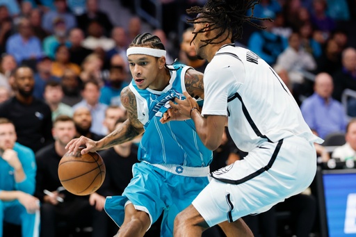 Charlotte Hornets guard Tre Mann, left, drives into Brooklyn Nets forward Ziaire Williams during the first half of an NBA basketball game in Charlotte, N.C., Wednesday, Oct. 22, 2025. (AP Photo/Nell Redmond) Charlotte Hornets guard Tre Mann, left, drives into Brooklyn Nets forward Ziaire Williams during the first half of an NBA basketball game in Charlotte, N.C., Wednesday, Oct. 22, 2025. (AP Photo/Nell Redmond)