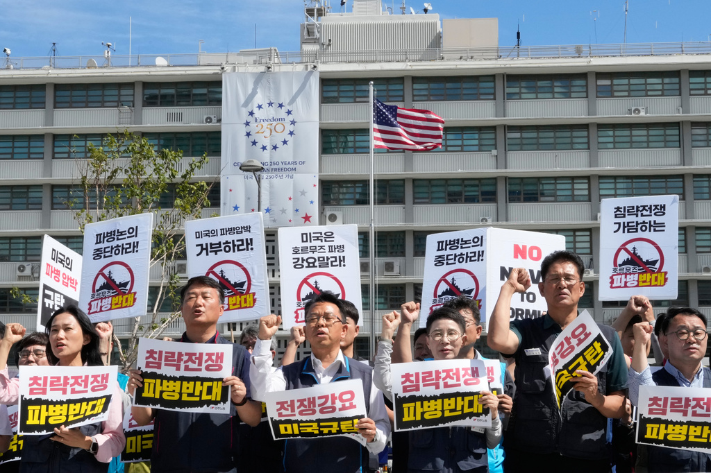 Protesters stage a rally against the possible deployment of South Korean troops to the Strait of Hormuz and a U.S. demand for the deployment, near the U.S. Embassy in Seoul, South Korea, Thursday, Sept. 17, 2026. The banners read ''Oppose troop deployment.'' (AP Photo/Ahn Young-joon)