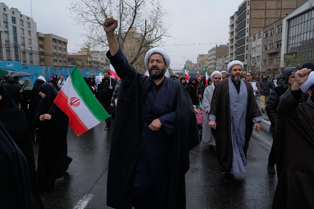 A cleric chants slogans during the annual anti-Israeli Quds Day, or Jerusalem Day rally in support of Palestinians in Tehran, Iran, Friday, March 13, 2026. (AP Photo/Vahid Salemi)