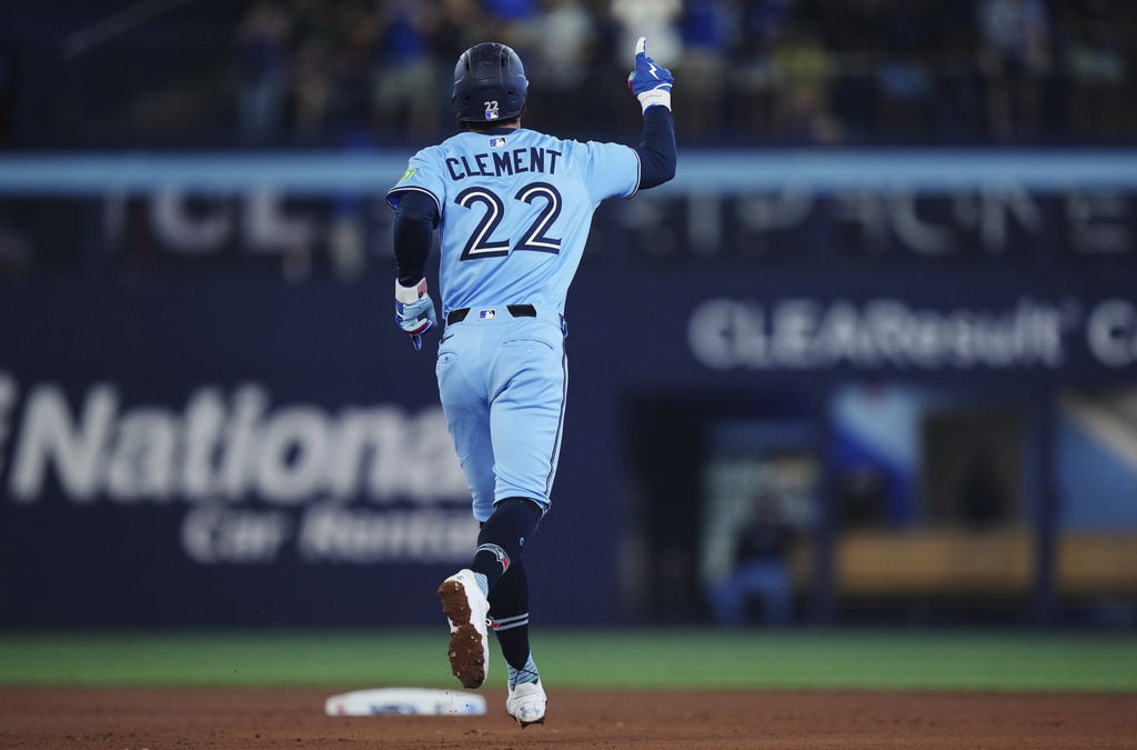 Toronto Blue Jays' Ernie Clement celebrates his three-run home run against the Chicago Cubs during fourth inning MLB baseball action in Toronto on Tuesday, August 12, 2025. (Nathan Denette/The Canadian Press via AP)