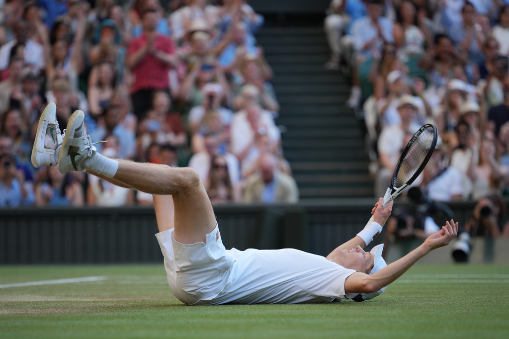 Jannik Sinner of Italy celebrates after winning a point against Alexander Zverev of Germany men's singles final at Wimbledon Tennis Championships in London, Sunday, July 12, 2026. (AP Photo/Kin Cheung)