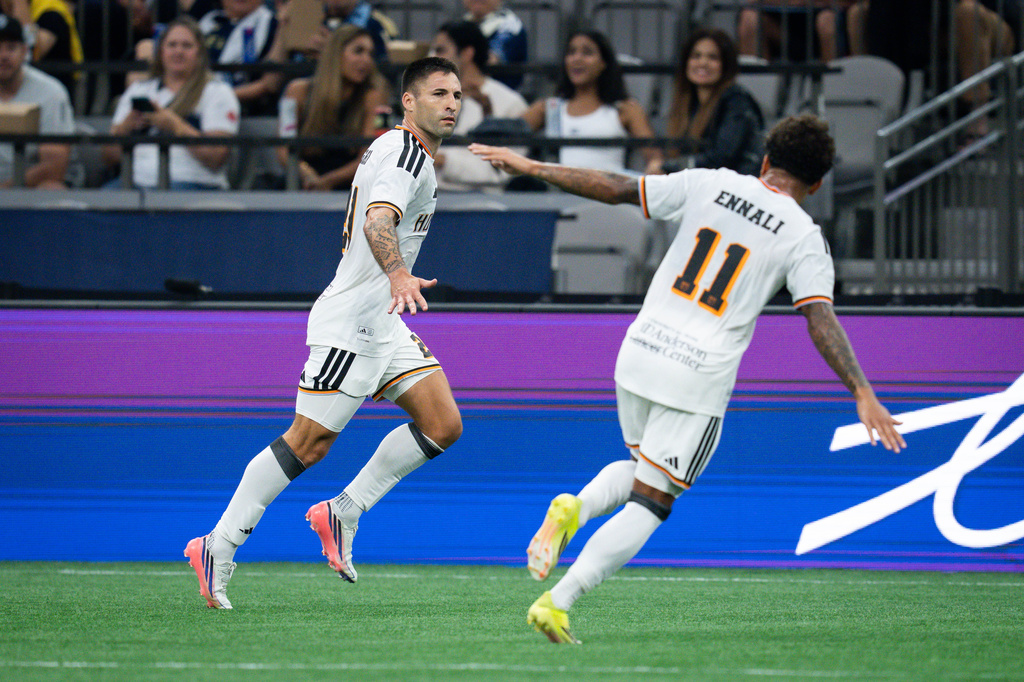Houston Dynamo FC's Franco Negri, left, celebrates his goal against the Vancouver Whitecaps with Lawrence Ennali during the first half of an MLS soccer match in Vancouver, B.C., on Wednesday, Aug. 19, 2026. (Ethan Cairns/The Canadian Press via AP)