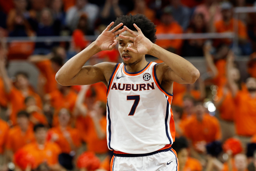 Auburn guard Keyshawn Hall reacts after a three pointer against Alabama during the first half of an NCAA college basketball game Saturday, Feb. 7, 2026, in Auburn, Ala. (AP Photo/Butch Dill)