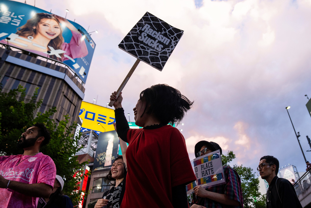 FILE - Demonstrators take part in a 'protest rave' against racism and nationalist party Sanseito ahead of the upper house election in the Shinkuku district of Tokyo, on July 13, 2025. (AP Photo/Louise Delmotte, File)